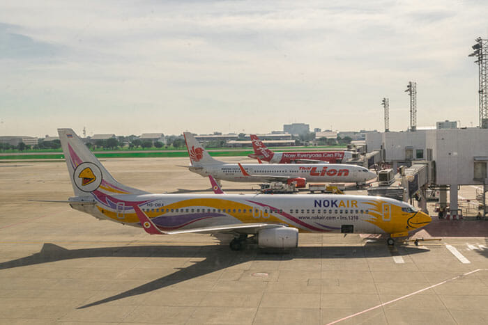 Nok Air, Lion Air, and Air Asia planes parked at Don Mueang Airport