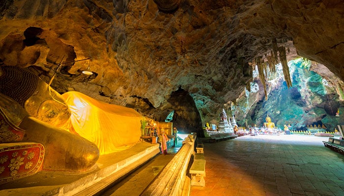 Multiple buddha statues inside Tham Khao Luang cave