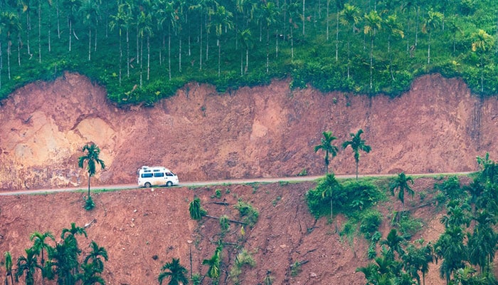 Minivan driving over a newly opened mountain pass, between Sindin and Tagu in the Tanintharyi Region, Southern Myanmar.