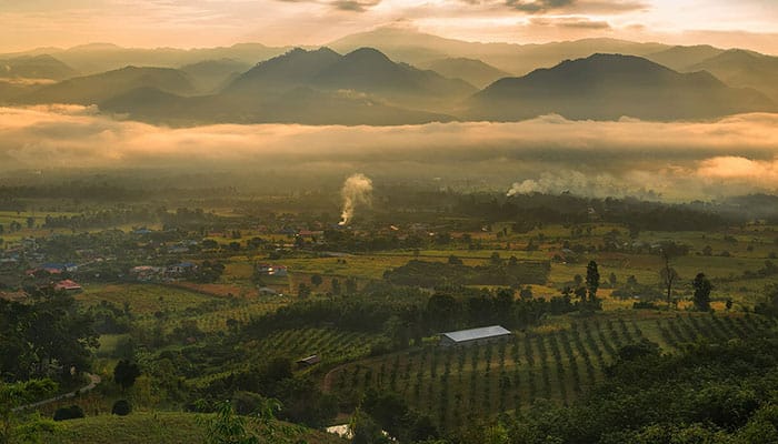 Pai valley in sunrise with clouds and fog