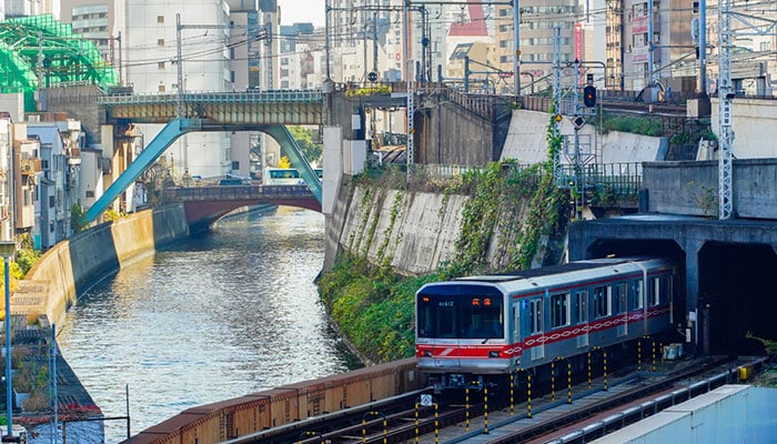 Tokyo Metro Subway Line and JR Yamanote Line Train running through the city