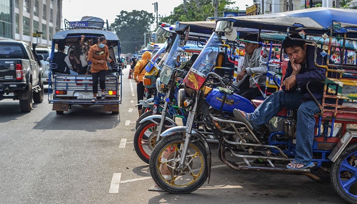 Tuk tuk taxi on street in Vientiane