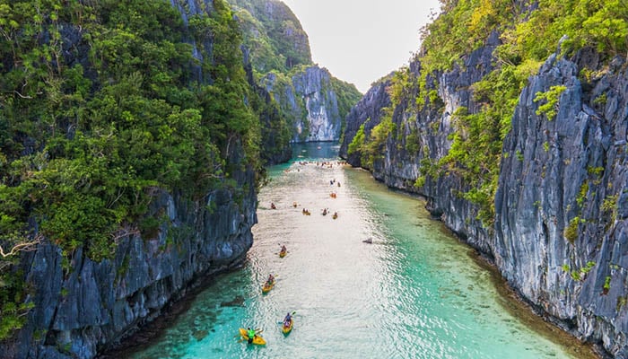 Kayaks in a narrow passage in Big Lagoon, El Nido