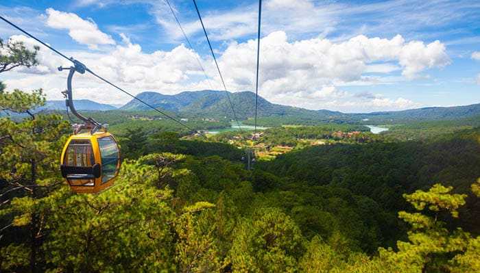 Beautiful panorama over mountains and the Truc Lam lake seen from a cable car in Dalat