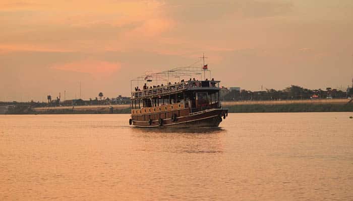 River Cruise on the Mekong River in the city of Phnom Penh. During summer with soft evening light.