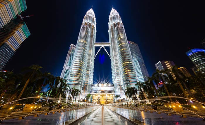 Petronas Twin Towers light up with fountains infront
