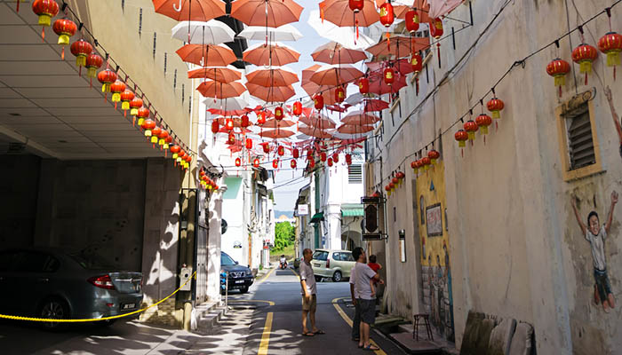 People looking at Wall Art Murals in Ipoh