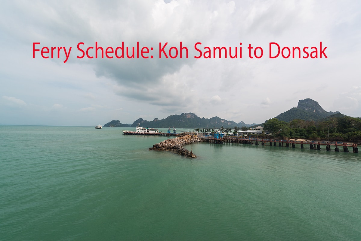 Scenic view of Donsak Pier with surrounding mountains and calm sea under an overcast sky. Text "Ferry Schedule: Koh Samui to Donsak" is displayed in red at the top of the image.